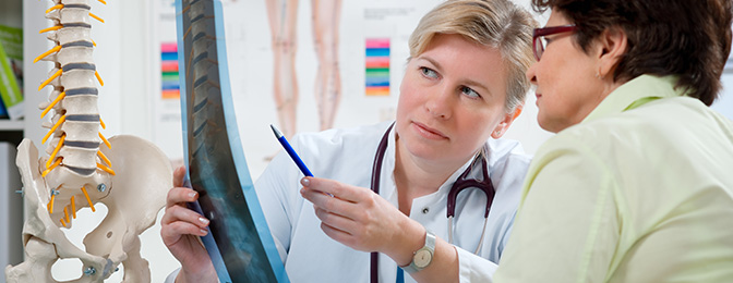 Physician discussing an x-ray with a patient
